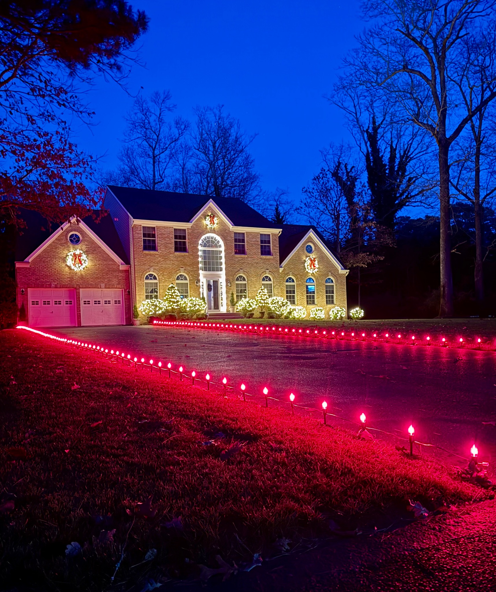 South Jersey Lights installation with red driveway stake lights and warm white roofline lighting